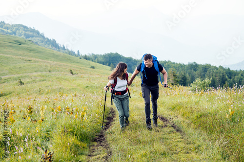 Young hipster couple hikes on mountain  © Novak