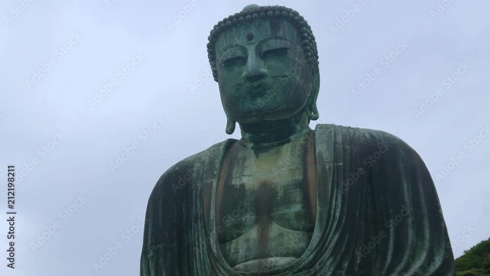 Most famous landmark in Kamakura - The Great Buddha Daibutsu - TOKYO / JAPAN - JUNE 12, 2018 Most famous landmark in Kamakura - The Great Buddha Daibutsu - TOKYO / JAPAN - JUNE 12, 2018