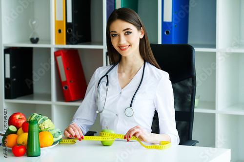 Health and Beauty. Portrait of a Happy Dietitian in the Light Room. Healthy Nutrition. A Doctor with a Beautiful Smile. High Resolution