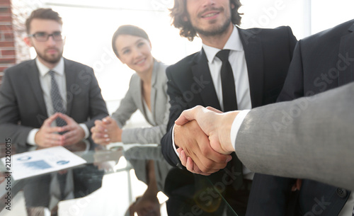 background image of handshake of business partners