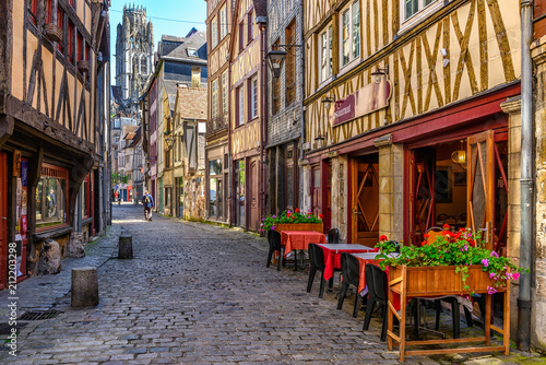 Fototapeta Naklejka Na Ścianę i Meble -  Cozy street with timber framing houses and tables of restaurant in Rouen, Normandy, France