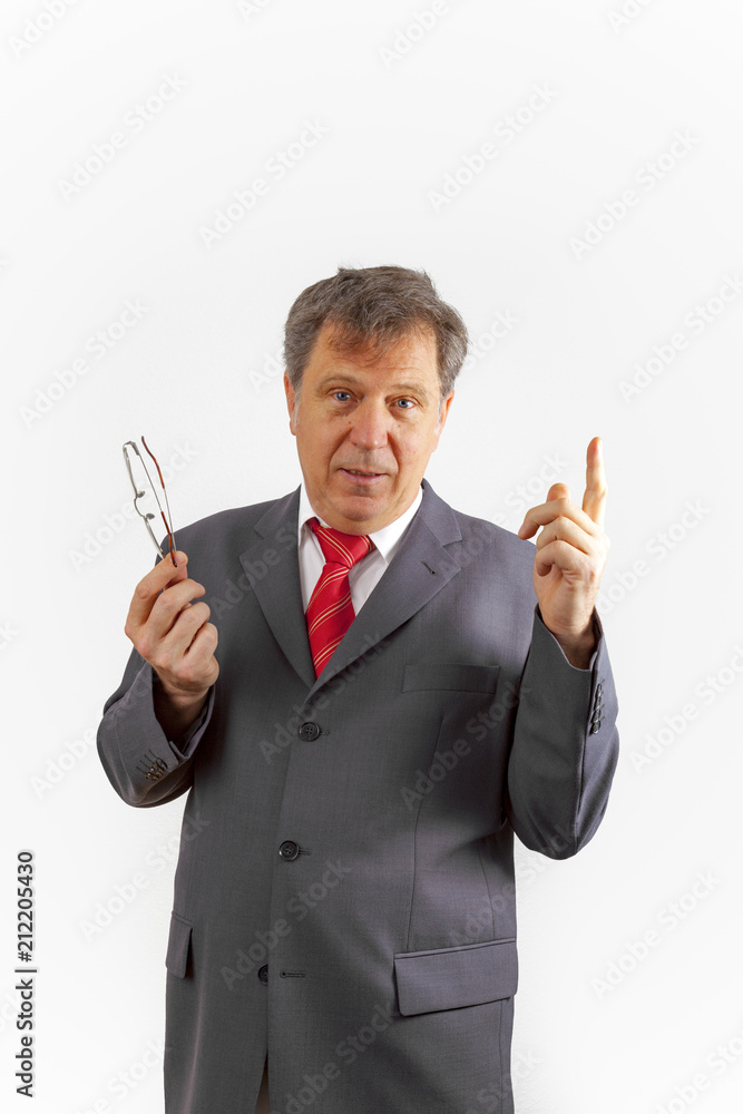 business man with reading glasses in hand holding a speach business man with reading glasses in hand holding a speach