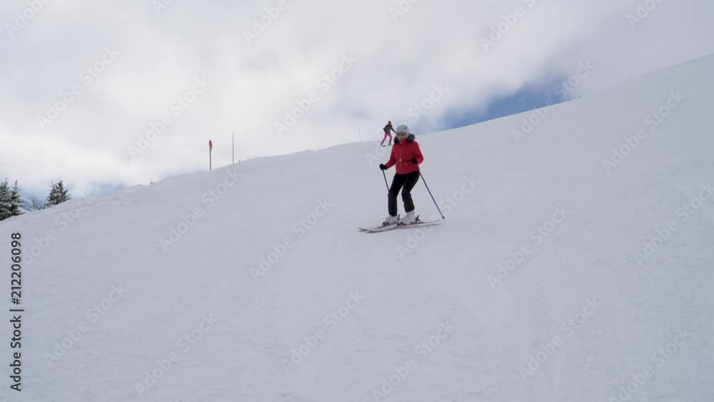 Skiers Skiing On The Difficulty Mountain Downhill In Winter Ski Resort Skiers Skiing On The Difficulty Mountain Downhill In Winter Ski Resort