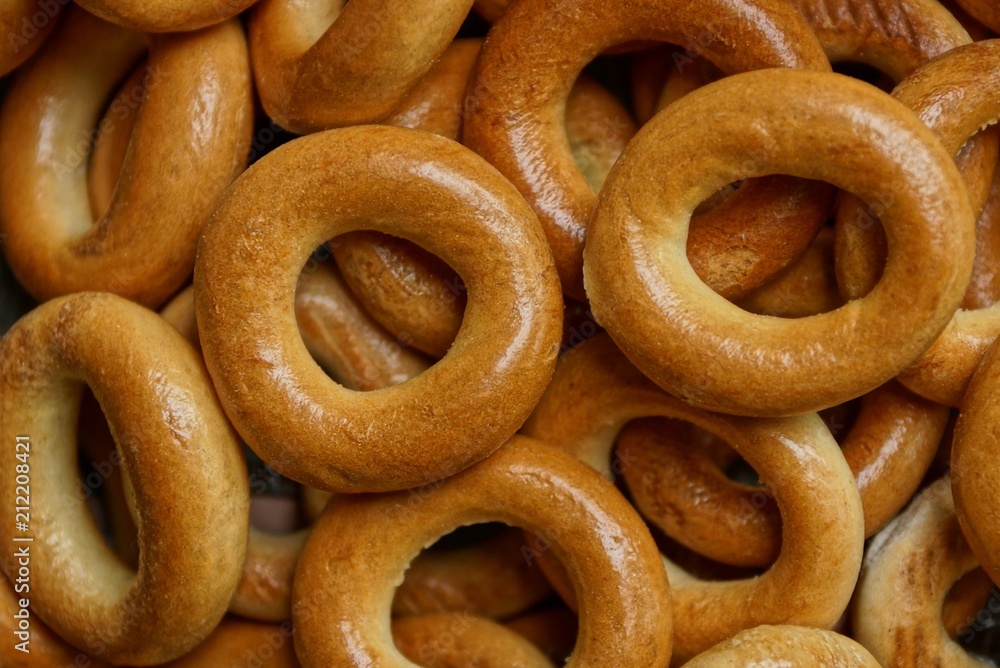 brown texture of small round bagels in a heap brown texture of small round bagels in a heap