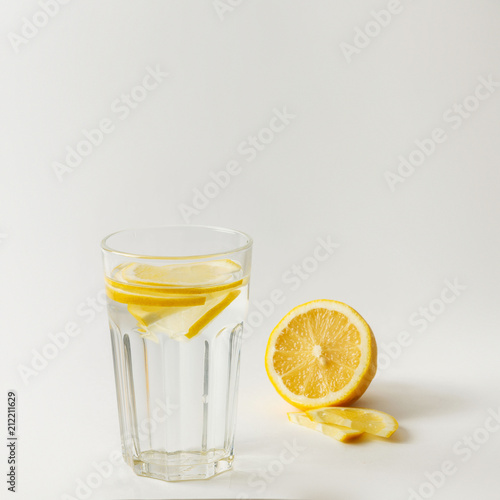 Fresh fresh water with lemon on a white background