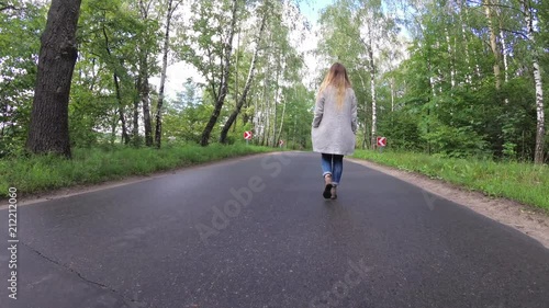 Wallpaper Mural the girl is walking along the road. Torontodigital.ca