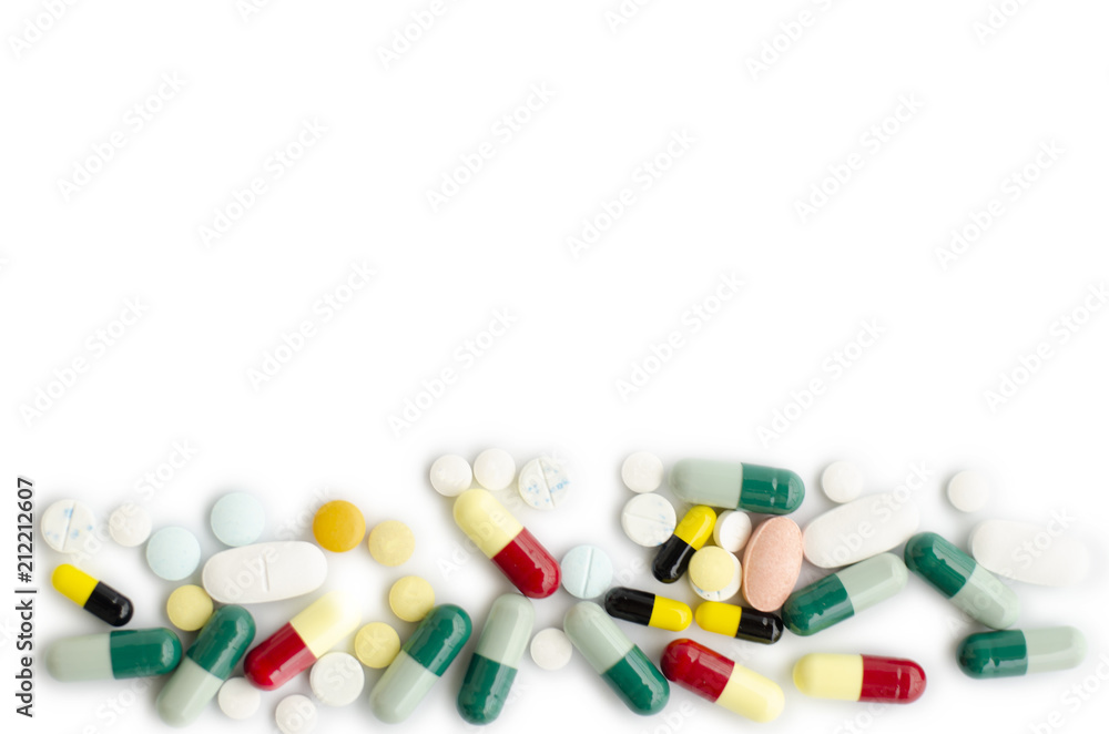 Green and yellow and blue pill or capsule on a white background. Green and yellow and blue pill or capsule on a white background.