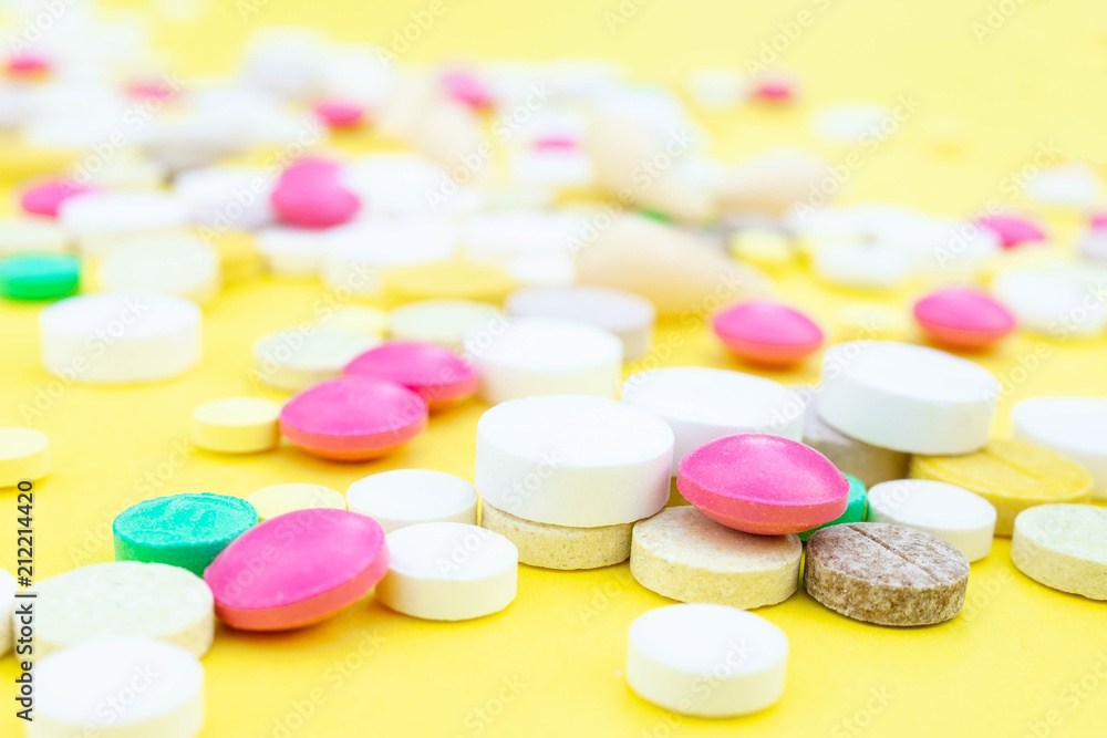 pills on a yellow background