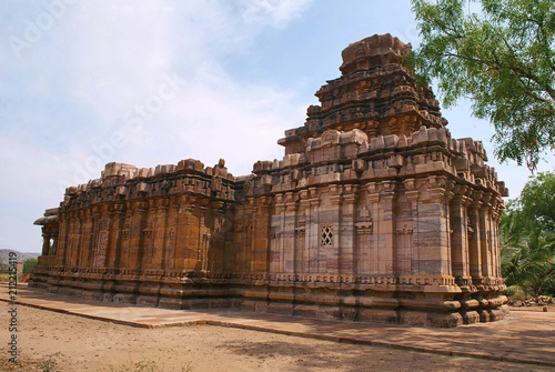 Dravidian vimana style sikhara and a view of the Devakoshthas on the south wall. Jain temple, Jinalaya, known as Jaina Narayana, Pattadakal, Karnataka. Northwest view. photo