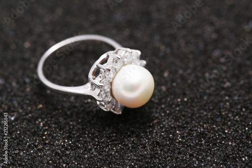 Pearl on diamond ring