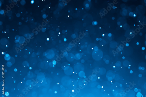 Dark blue abstract backgrounds with bokeh.