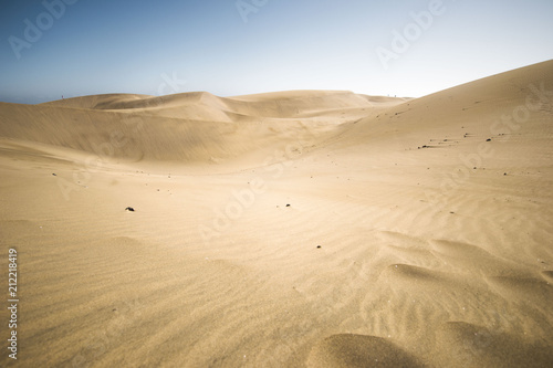 minimalistic view of sand dunes landscape, minimalism in nature, sand everywhere and windy weather, shapes and creations