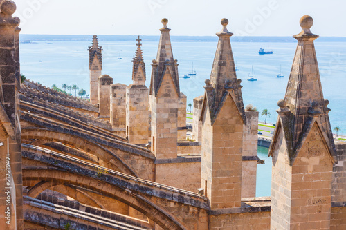 View over the sea with some boats from the terrace of the Cathedral of Santa Maria of Palma, also known as La Seu. Palma, Majorca, Spain photo