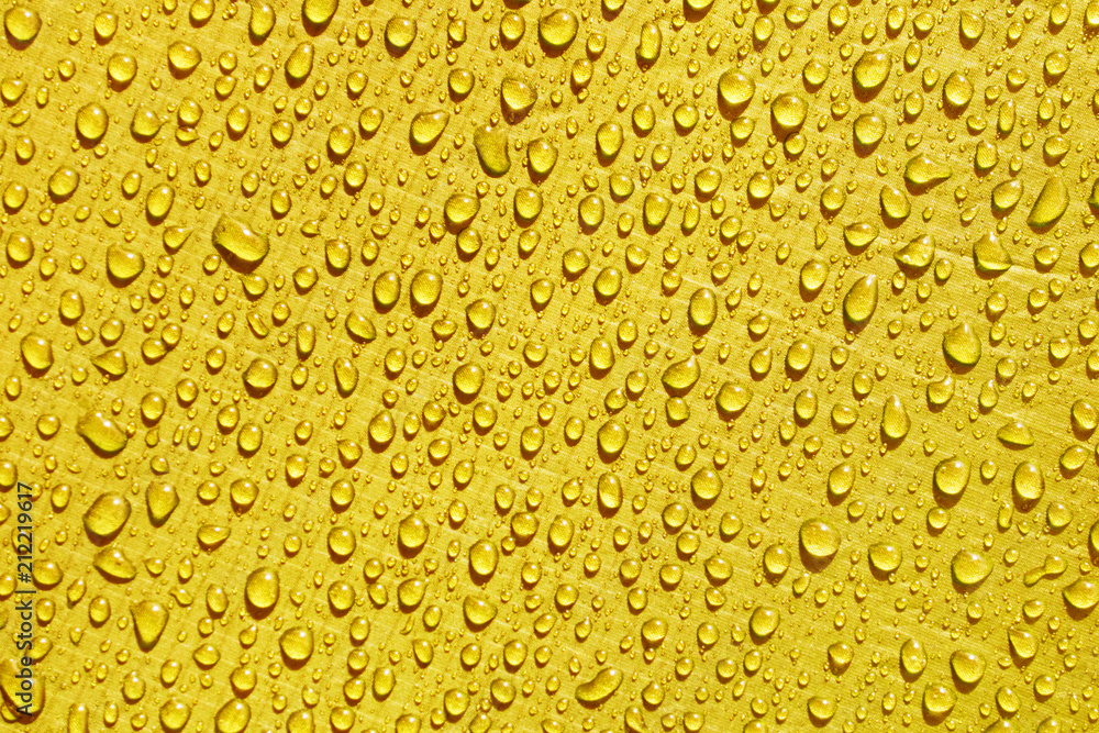 yellow waterproof material, rip stop cloth with drops of water yellow waterproof material, rip stop cloth with drops of water