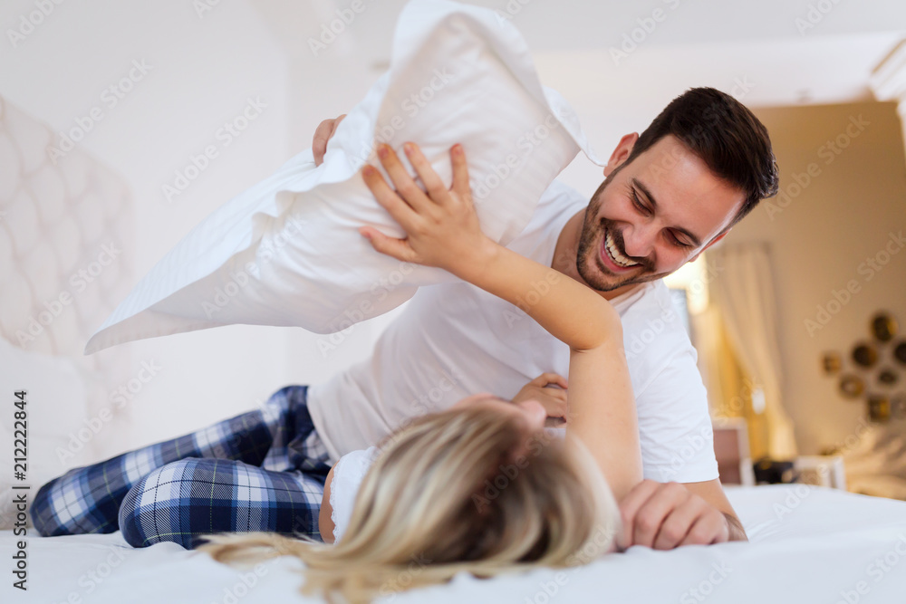 Young couple having having romantic times in bedroom Young couple having having romantic times in bedroom