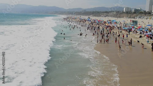 SANTA MONICA - AUGUST 2017: Tourists enjoy city beach. Santa Monica is a major tourist attraction in California