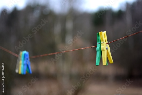 Four colorful clothespins