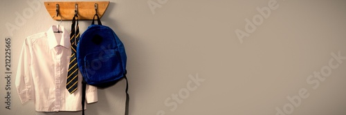 Fotografie School uniform and schoolbag hanging on hook