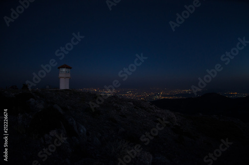 Night silhouette fire lookout station Athens Greece city background