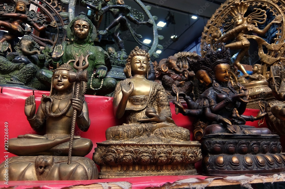 Fototapeta premium Small bronze statuettes on the street market in Rishikesh.