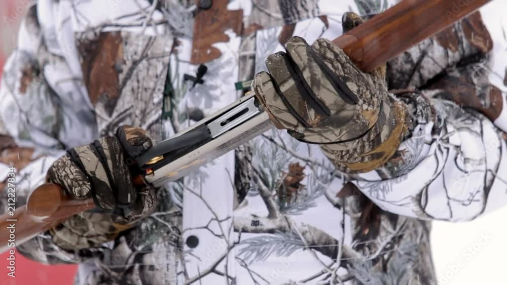 Close-up view of rifle. Hunter's hands hold a rifle Close-up view of rifle. Hunter's hands hold a rifle