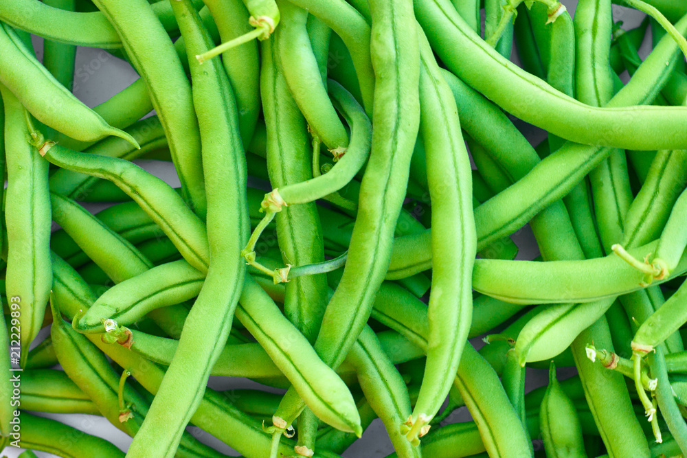 Pile of green beans, photographed on blurred background, natural fresh product Pile of green beans, photographed on blurred background, natural fresh product