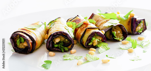 guinea squash rolls with processed parmesan, pine nuts, and garlic with addittion of fresh herbs