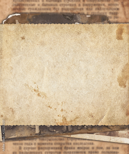 Vintage photo paper on old newspaper texture background