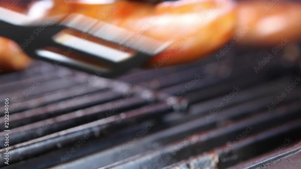 Close up of sausages being grilled on a BBQ. Close up of sausages being grilled on a BBQ.