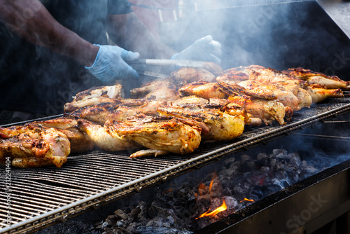 Chicken Grilling Over Open Fire on the Fourth of July at a Community Celebration