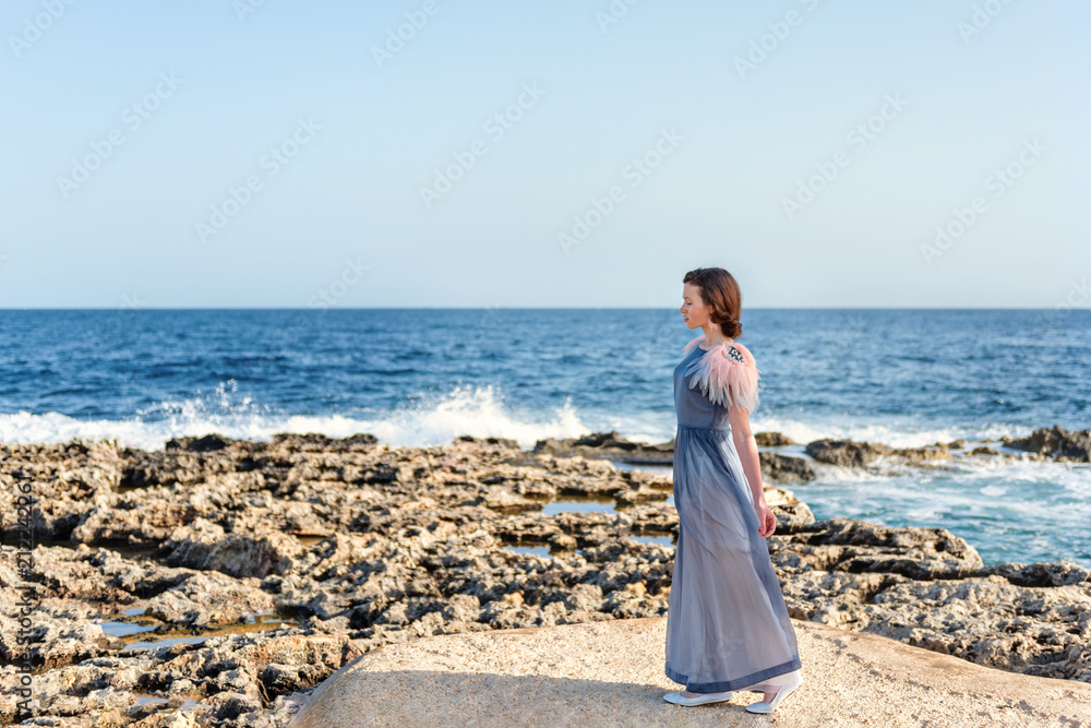 a young graceful maid treads lightly along the shore from the lava and brightly the blue sea and sky a young graceful maid treads lightly along the shore from the lava and brightly the blue sea and sky
