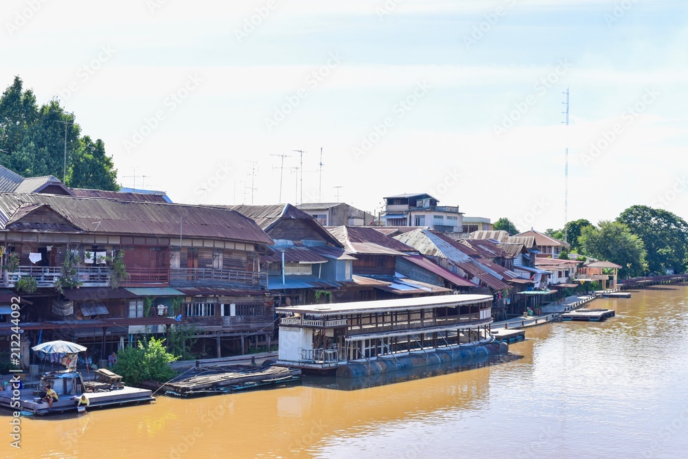 Naklejka premium Ancient Wooden Houses at Sam Chuk Market in Suphanburi Province, Thailand