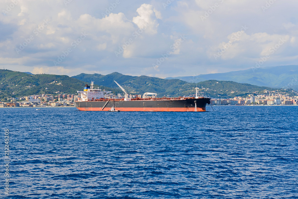 Cargo vessel at sea approaching port Cargo vessel at sea approaching port