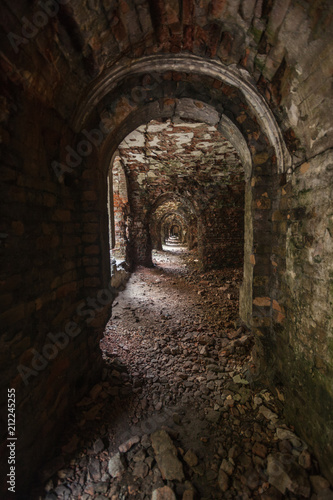 Fototapeta Naklejka Na Ścianę i Meble -  weathered dark corridor of old fortress