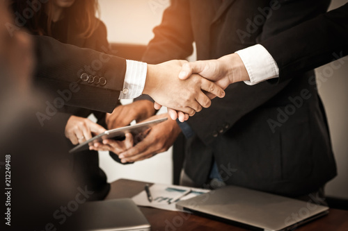 Business people join hands to congratulation the business deal. Business handshake.