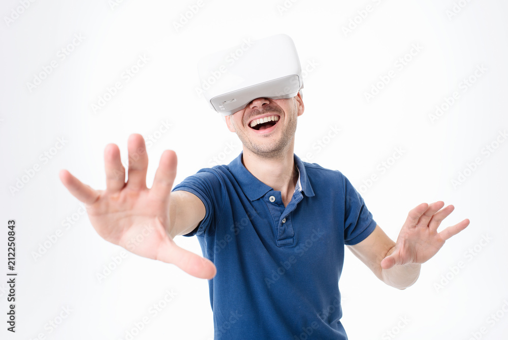 Into virtual reality world. Man wearing goggle headset, 3D rendering. Studio shot, white background