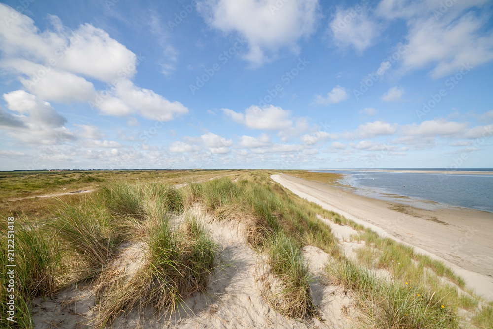 Dunes with beach and blue sky with clouds Dunes with beach and blue sky with clouds