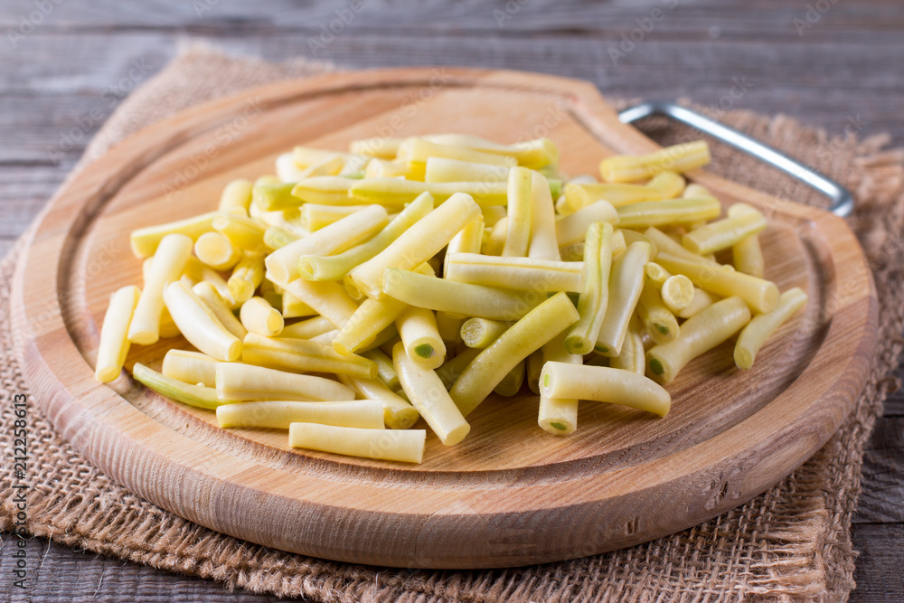 Chopped Raw Beans on a Wooden Cutting Board Chopped Raw Beans on a Wooden Cutting Board