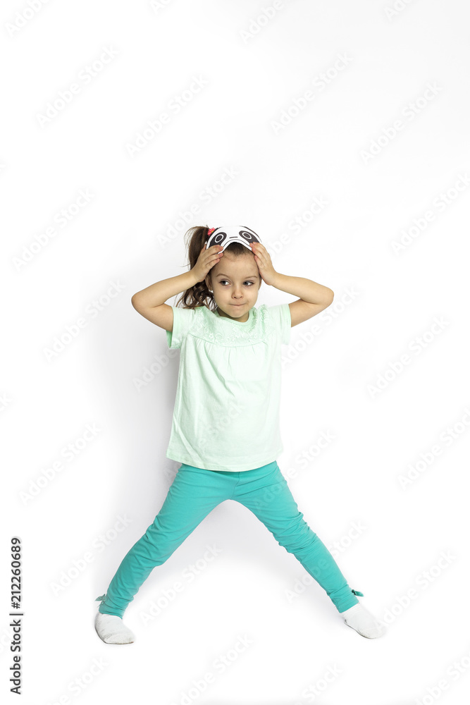 young girl in pajamas getting ready for bed