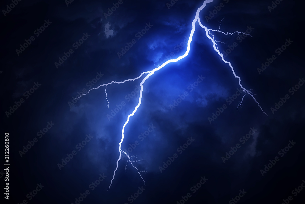 A lightning strike on a cloudy dramatic stormy sky.