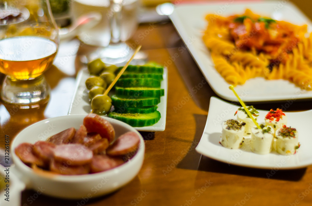 Set with different appetizers in small portions, healthy and delicious snacks Set with different appetizers in small portions, healthy and delicious snacks