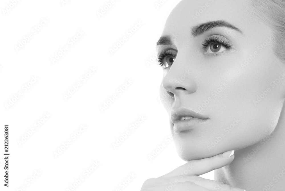 Black and white Beauty woman face portrait. Beautiful spa model girl with perfect fresh clean skin. Youth and skin care Concept. Isolated on a white background Black and white Beauty woman face portrait. Beautiful spa model girl with perfect fresh clean skin. Youth and skin care Concept. Isolated on a white background