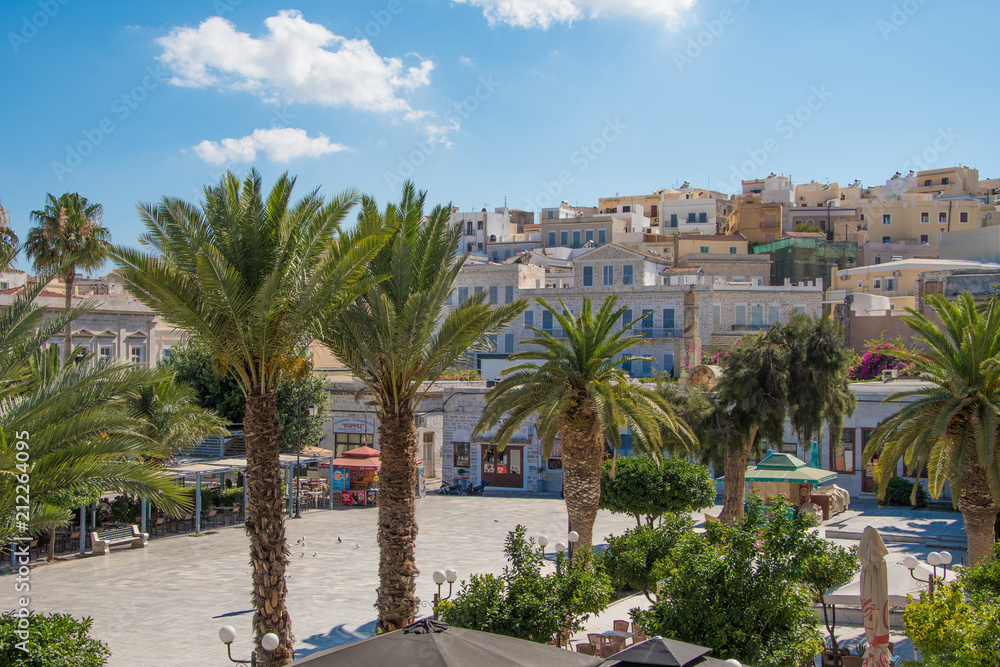 Central square or Miaoulis square with palm trees of Ermoupolis city in Syros island, Cyclades, Greece