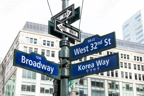 Manhattan NYC buildings of midtown near Korean Town, Korea Way road signs on west 32nd street, Broadway in New York City