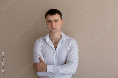young man. a man in a white shirt portrait of a man. business portrait. male portrait