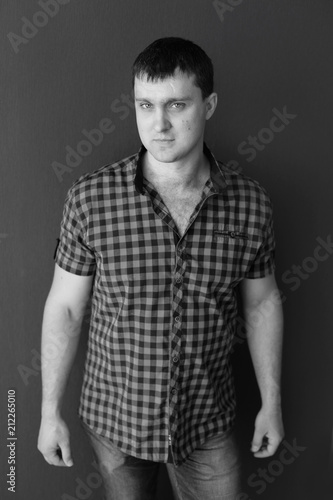 young man in shirt and jeans. portrait of man. black and white male portrait photos © Svetlana