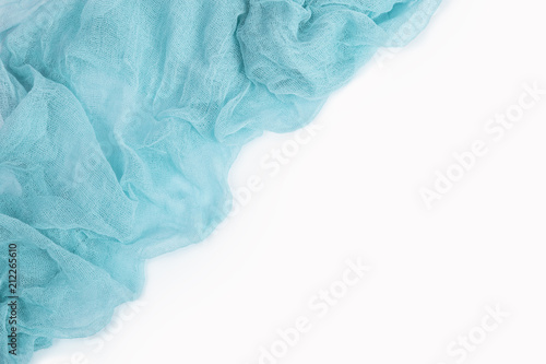 Light blue gauze fabric isolated on white background. Top view.