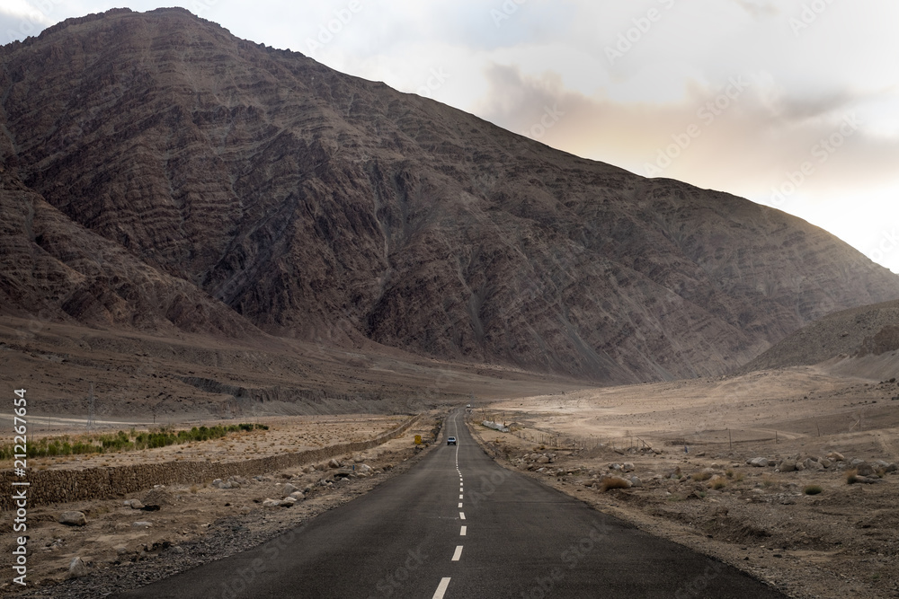 Landscapes of India country with the most dangerous road on the world. Mountains during a sunset or sunrise with golden sun. Himalayas amazing views. Indian Himalayas. Jammu and Kasmir state.
