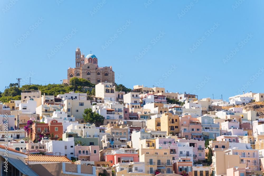 View of Ano Syros and the Orthodox Anastaseos church on the background in Syros island, Cyclades, Greece