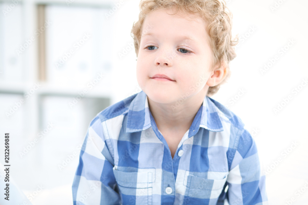 Doctor and child patient. Physician examines little boy by stethoscope. Medicine and children's therapy concept Doctor and child patient. Physician examines little boy by stethoscope. Medicine and children's therapy concept